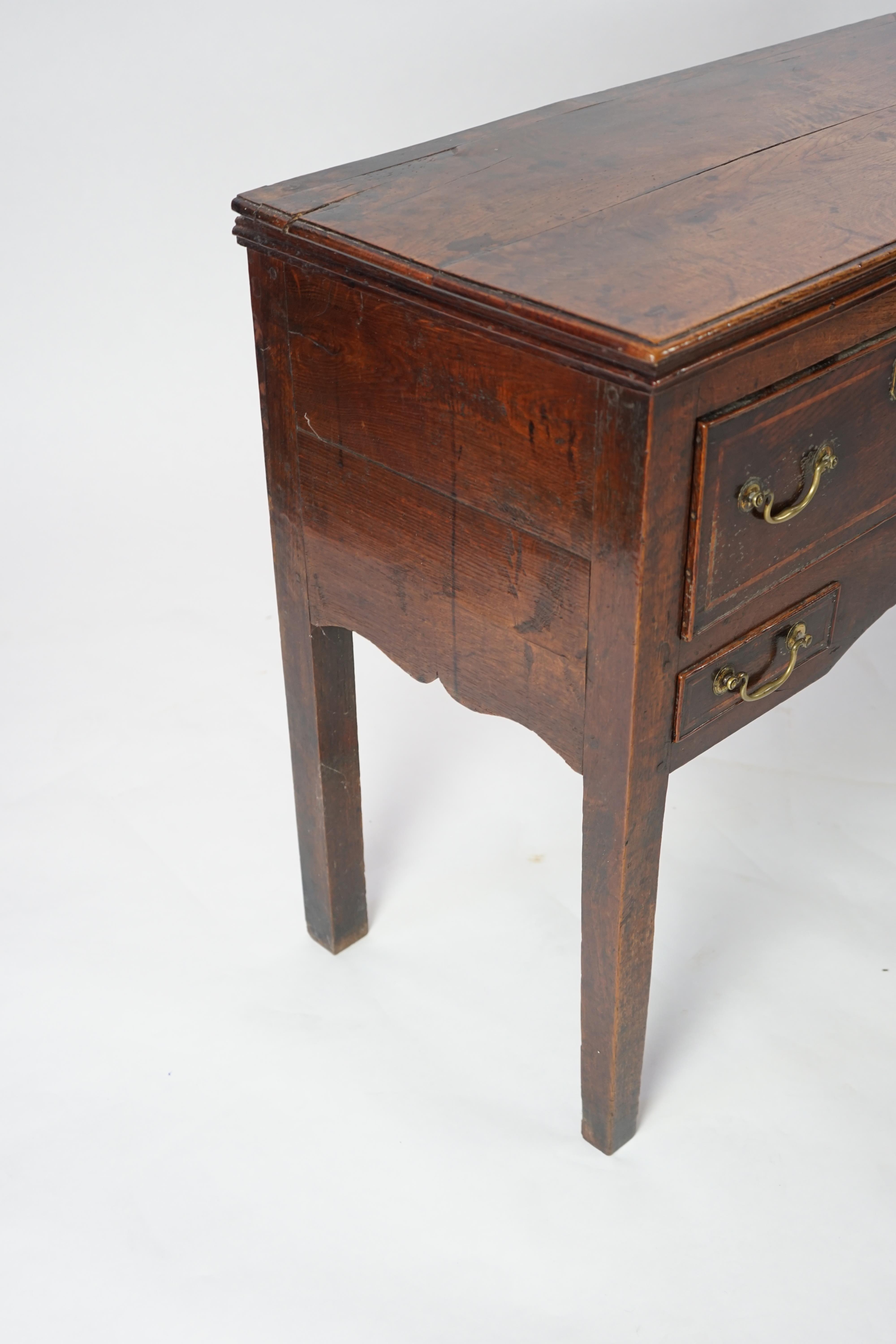 A mid 18th century oak dresser base